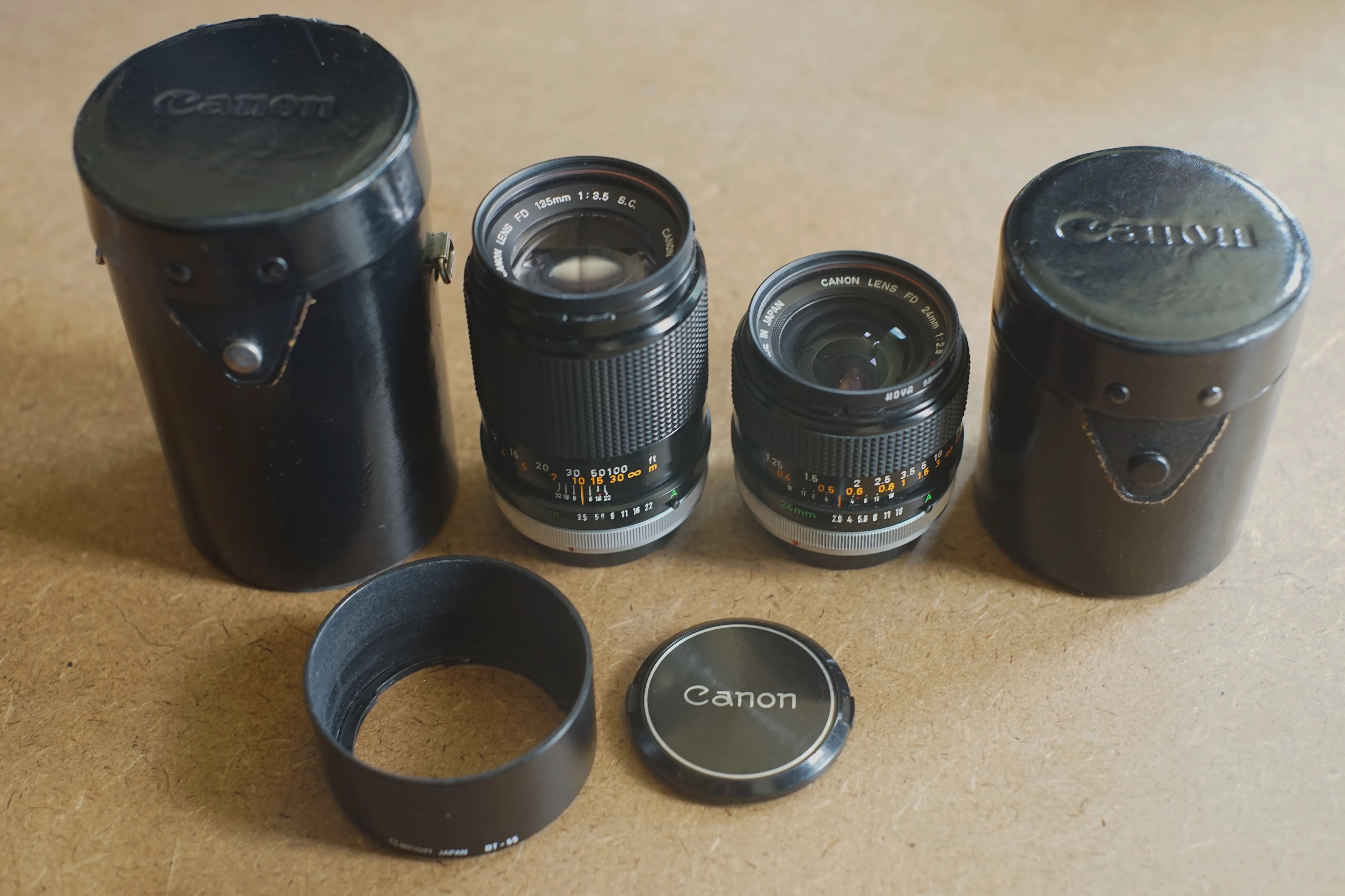The 28mm f/2.8 and 135mm f/3.5 Canon FD lenses.