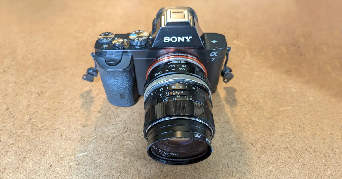 A Sony α7 I camera body with an adapted Super TAKUMAR 50mm f/1.4 lens attached to it.