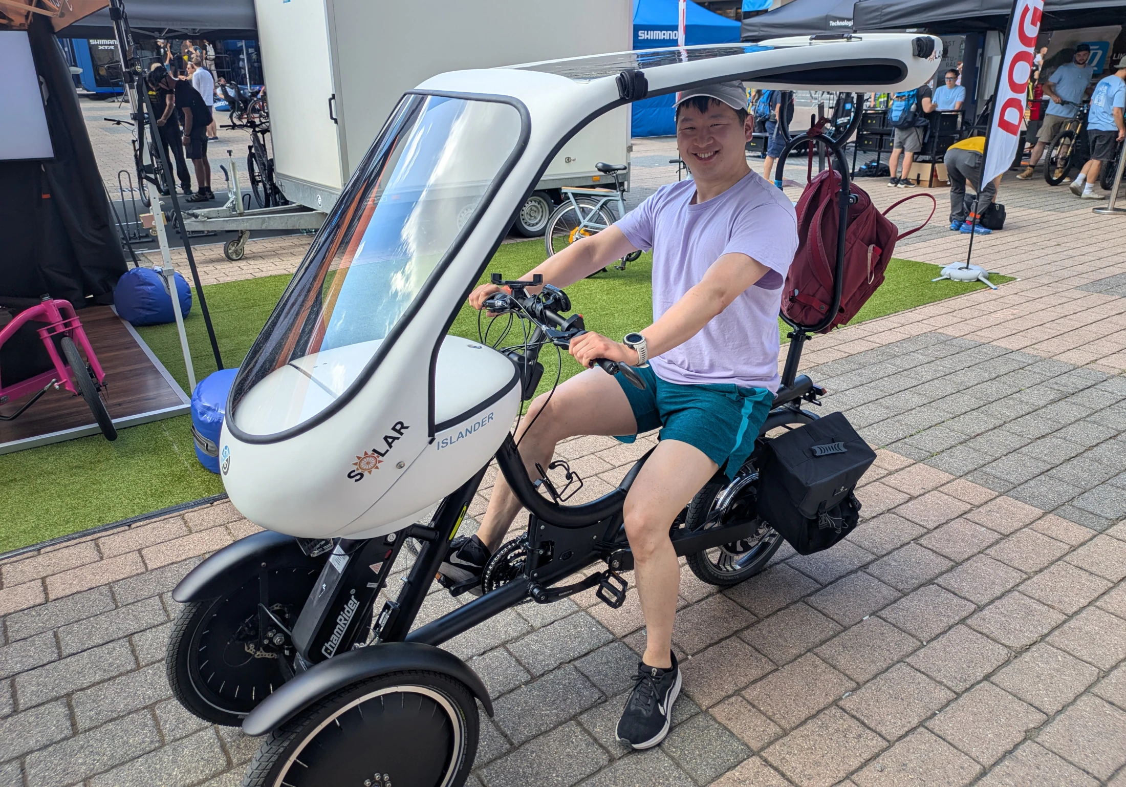 The Sunnyclist reverse tilting tricycle. The rider has no affiliation with the product.